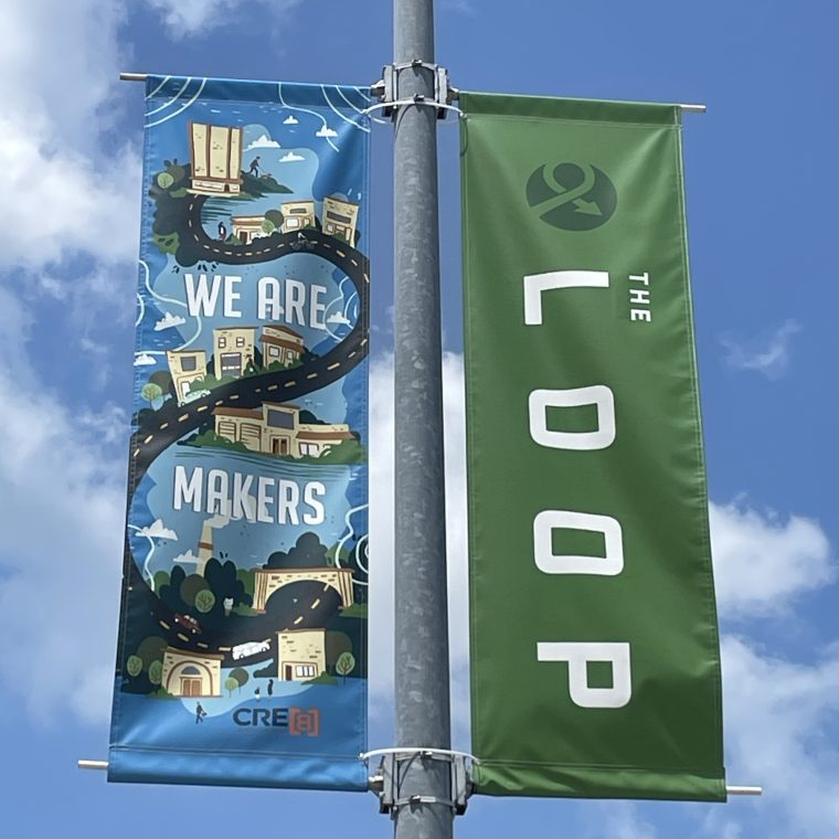 Loop Banners hanging on a light pole.